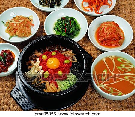 Stock Photograph - soup, stone pot, rice food mixed with seasonings in a hot stone pot, side dish, rice food mixed with seasonings, indoor. Fotosearch
