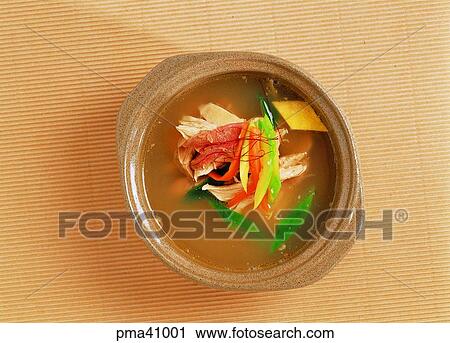Stock Image - thick beef soup, gomtang, thick beef soup with chicken, dakgomtang, aiding virility, food to aid virility. Fotosearch