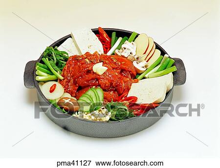 Stock Photo - meat, meat dish, frenched hot and spicy chicken ribs served with vegetables, dakgalbi, chicken, indoor. Fotosearch