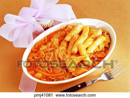 Stock Image - broiled dish of sliced rice cake and vegetables, ddukboki, Chinese noodles, ramen, noodles, powdered food, flour-based food. Fotosearch