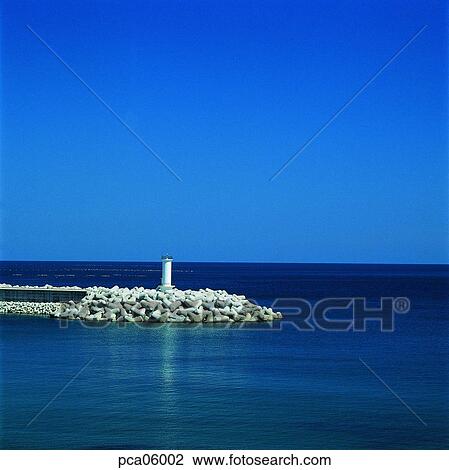 lighthouse, beacon, breakwater, bulwark, horizon, landscape, scenery View Large Photo Image Stock Image - lighthouse, beacon, breakwater, bulwark, horizon, landscape, scenery. Fotosearch
