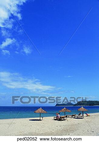 Stock Image - rest area, parasol, beach parasol, summer, sea, sand, sandy beach. Fotosearch