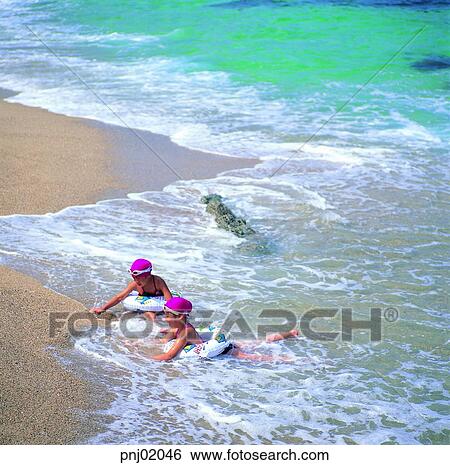 Stock Photograph - rippling, dabbling, leisure, wave, gentle waves, sandy beach, sea. Fotosearch