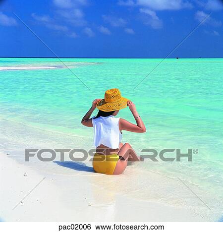 Stock Photograph - sea, woman, women, female, behind, back, Oriental. Fotosearch