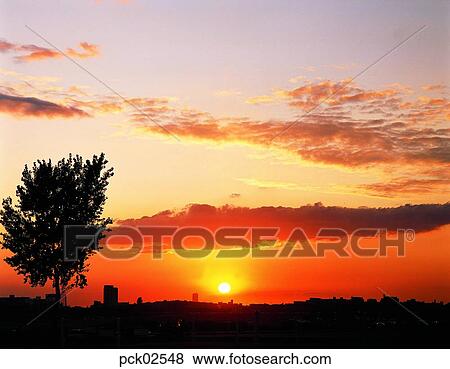Stock Photo - red sky, sunrise, sunset, cloud, sky, sunset, sundown. Fotosearch