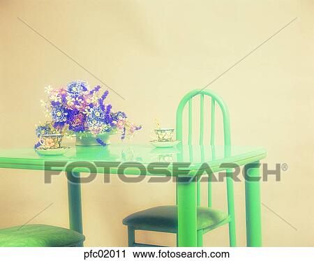 Stock Image - table, chair, bench, sofa, flower decoration, coffee glass, teacup. Fotosearch