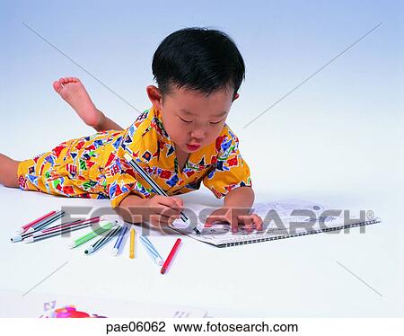 drawing a picture, lying on the ground, color pencil, sketch book, boy, boy, person View Large Photo Image Stock Image - drawing a picture, lying on the ground, color pencil, sketch book, boy, boy, person. Fotosearch