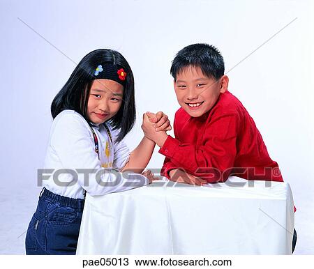 hand wrestling, boasting of one's strength, man and woman, men and women, male and female, confrontation, children View Large Photo Image Stock Image - hand wrestling, boasting of one's strength, man and woman, men and women, male and female, confrontation, children. Fotosearch