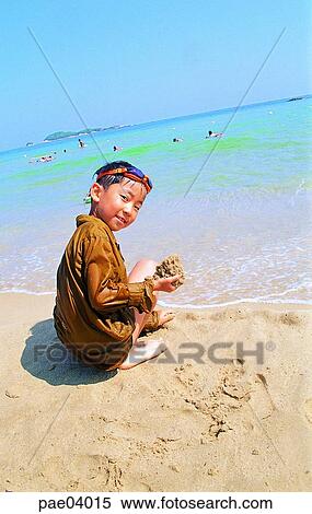 playing with sand, sea, sea, sandy beach, children, child, kid View Large Photo Image Stock Photography - playing with sand, sea, sea, sandy beach, children, child, kid. Fotosearch