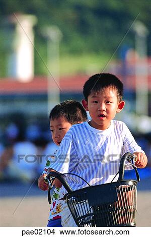 riding a bike, riding a bicycle, bike, bicycle, brother, two people, friendship View Large Photo Image Picture - riding a bike, riding a bicycle, bike, bicycle, brother, two people, friendship. Fotosearch