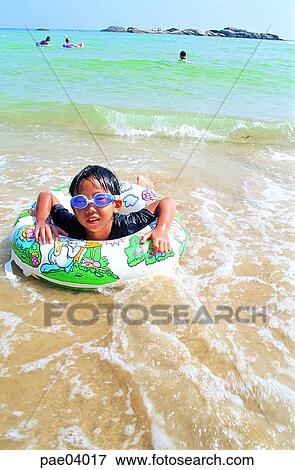 rippling, dabbling, swimming beach, swim, swimming, tube, swimming goggles View Large Photo Image Stock Photo - rippling, dabbling, swimming beach, swim, swimming, tube, swimming goggles. Fotosearch