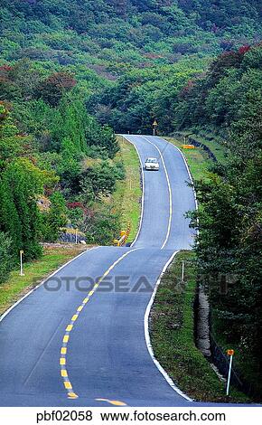 Stock Photo - transportation, traffic, transit, traffic and street, traffic and road, traffic and way, curved road. Fotosearch