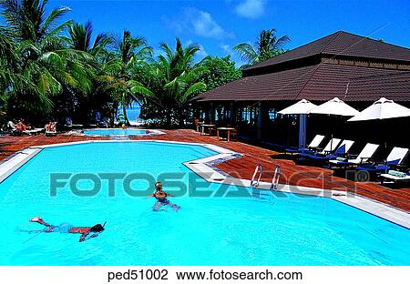 Stock Image - building, construction, travel place, destination, day, two people, Maldives. Fotosearch
