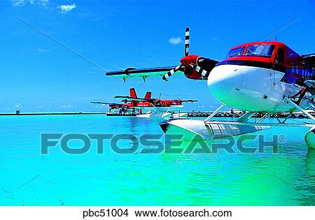 transportation, day, two vehicles, two cars, Maldives, sea, airplane over the sea View Large Photo Image Picture - transportation, day, two vehicles, two cars, Maldives, sea, airplane over the sea. Fotosearch