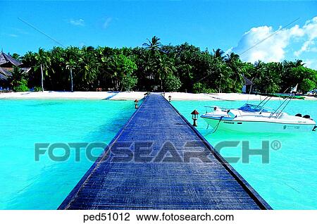 Stock Image - travel place, destination, day, bridge, motor boat, Maldives, sea. Fotosearch