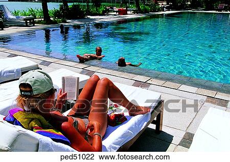 Stock Image - travel place, destination, day, reading, Lagen resort, white, white man. Fotosearch