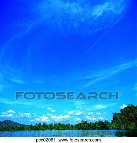 Stock Image - river and sky, sightseeing, tourism, cloud, tree, weather, Southern Asia. Fotosearch