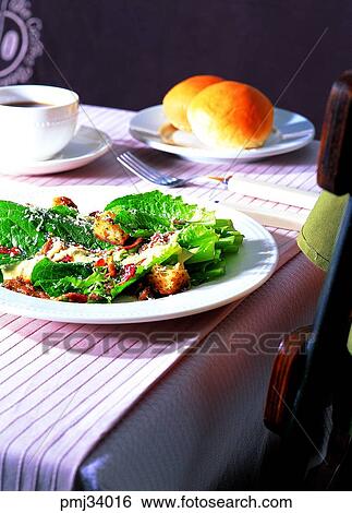 Stock Photograph - desert, bread, salad, Caesar salad, table, coffee. Fotosearch