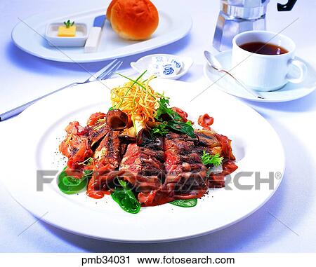 Stock Image - ribeye steak, bread, western dish, western food, steak, western dish. Fotosearch