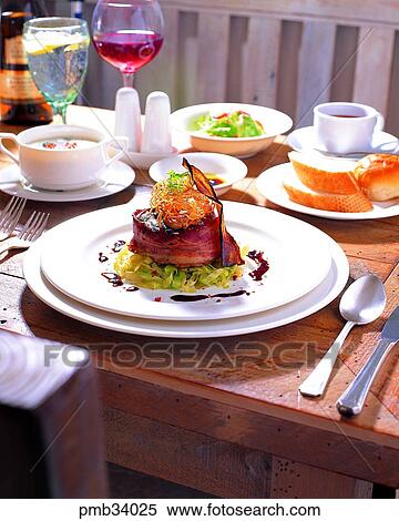 rolled bacon steak, table setting, western dish, western food, setting, steak View Large Photo Image Stock Photography - rolled bacon steak, table setting, western dish, western food, setting, steak. Fotosearch