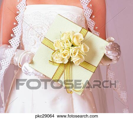 Picture - marriage, dress, wedding veil, bridal veil, person, gift, present. Fotosearch