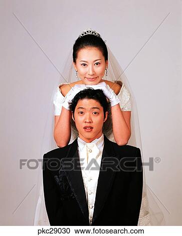 Stock Image - marriage, man and woman, men and women, male and female, Oriental, two people, two guys. Fotosearch