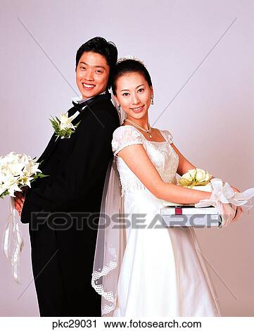 Stock Image - marriage, man and woman, men and women, male and female, Oriental, two people, two guys. Fotosearch