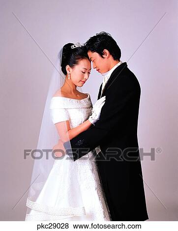 Stock Photo - marriage, man and woman, men and women, male and female, closing eyes looks, warm-hearted, Oriental. Fotosearch