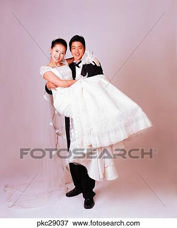 marriage, wedding ceremony, man and woman, men and women, male and female, Oriental, two people View Large Photo Image Stock Photo - marriage, wedding ceremony, man and woman, men and women, male and female, Oriental, two people. Fotosearch