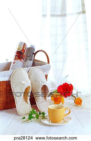 Picture - lifestyle, basket, slippers, magazine, flower, cup, curtain. Fotosearch