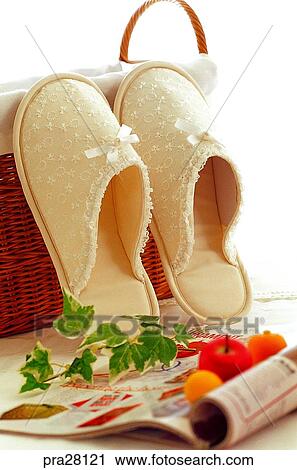 Stock Image - lifestyle, basket, slippers, magazine. Fotosearch