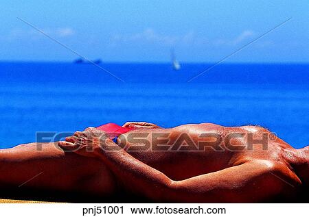 Stock Image - men, male, males, day, lie, lying. Fotosearch