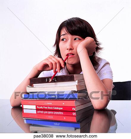 Stock Photo - student, students, school girl, girl student, book, books, pencilpencils. Fotosearch