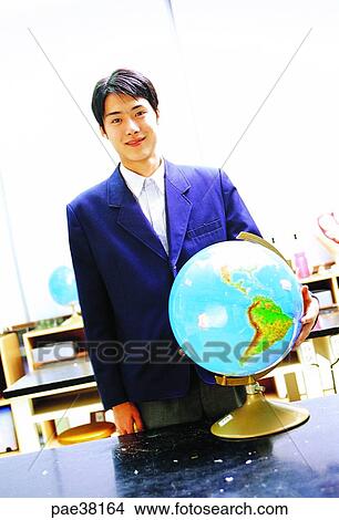 student, students, school boy, boy student, globe, globe ball, ball View Large Photo Image Picture - student, students, school boy, boy student, globe, globe ball, ball. Fotosearch