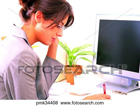 Stock Photo - woman, female, glasses, monitor, career woman, business woman, business. Fotosearch