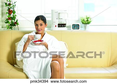 woman, female, gown, bath gown, table clock, cup, teacup View Large Photo Image Picture - woman, female, gown, bath gown, table clock, cup, teacup. Fotosearch