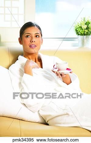 woman, female, gown, bath gown, table clock, cup, teacup View Large Photo Image Stock Photography - woman, female, gown, bath gown, table clock, cup, teacup. Fotosearch