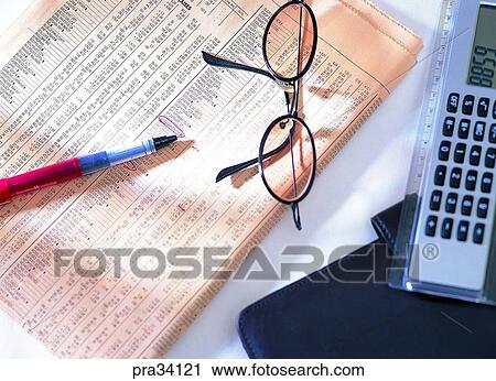 Stock Image - living, life, newspaper, check, note, write, glasses. Fotosearch