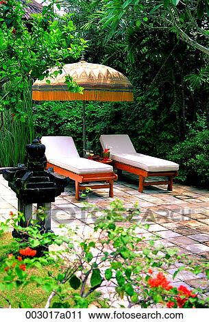 Indonesia, Lombok Island, resort, garden, bed, umbrella View Large Photo Image Stock Image - Indonesia, Lombok Island, resort, garden, bed, umbrella. Fotosearch