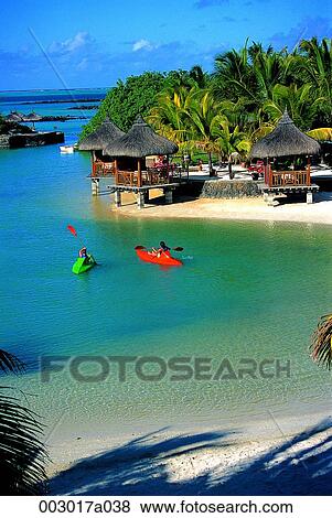 Stock Photo - person, Africa, Mauritius, resort, kayak, traditional house, leisure. Fotosearch