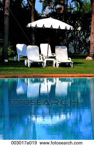 person, Taiwan, Dusit Polo, resort, chair, umbrella View Large Photo Image Stock Photo - person, Taiwan, Dusit Polo, resort, chair, umbrella. Fotosearch