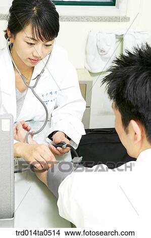 person, medical treatment, medicine, Korean, doctor, patient, stethoscope View Large Photo Image Picture - person, medical treatment, medicine, Korean, doctor, patient, stethoscope. Fotosearch