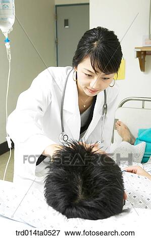 Stock Photo - person, medical treatment, medicine, indoor, hospital, sick room, patient. Fotosearch