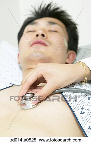 Stock Photo - person, medical treatment, medicine, indoor, hospital, sick room, patient. Fotosearch