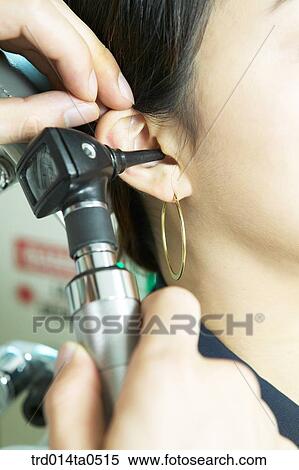 Stock Photography - person, medical treatment, medicine, patient, ear, otorhinolaryngology, inspection. Fotosearch