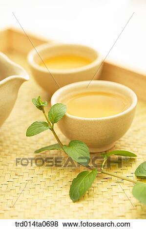 Stock Photo - herb, herbtea, herbtea, plate, flowerpot, wellbeing, cup. Fotosearch