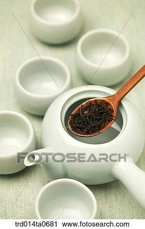 Stock Image - persimmon tea, persimmon, teapot, spoon, cup, bottle. Fotosearch