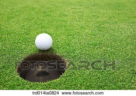 Picture - golf, field, hole, golf ball, ball. Fotosearch