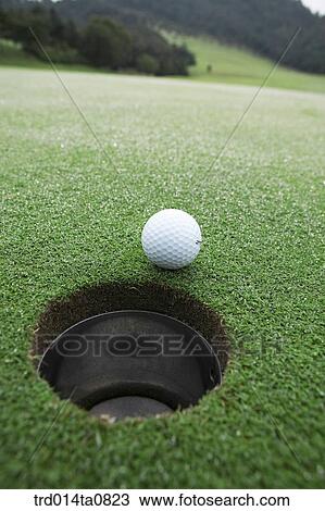 Stock Image - golf, field, hole, golf ball, ball. Fotosearch