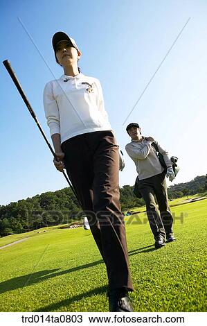 Stock Image - person, leisure, free time, hobby, golf, field, Korean. Fotosearch